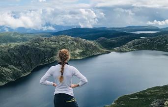 girl standing on topp of Mount Toreskyrkja