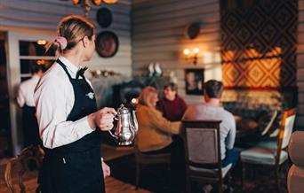 Waitress at restaurant at Tuddal Høyfjellshotell