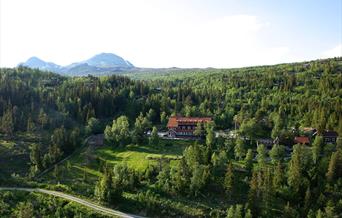 Tuddal Høyfjellshotel in the summer with Gaustatoppen in the background