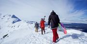 people with skis at Mount Gausta