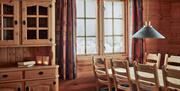 dining table by the window at the cottage at Gaustablikk Fjellresort